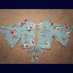 Greenish floral blouse w/ open back and front.